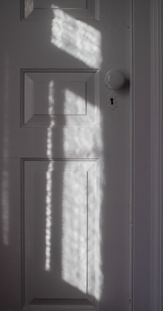 New England Federal House Interior Door with Splach of Window Light.